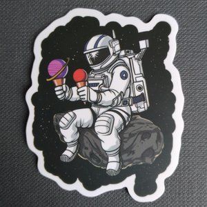 Astronaut holding ice cream sticker